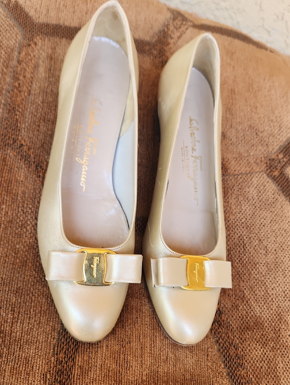 Salvatore Ferragamo Cream Leather Vara Bow Flats with Gold Plaque